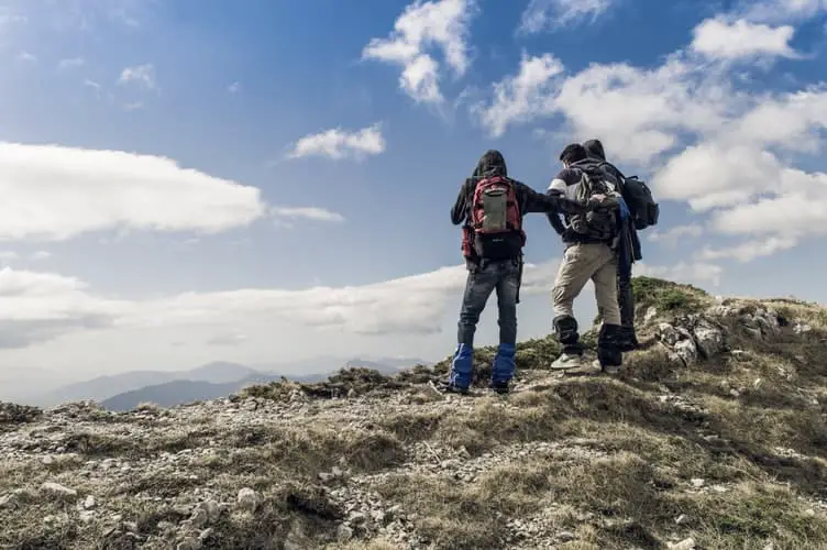 group of hikers on summit